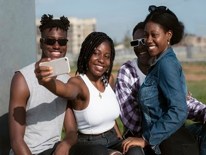 medium shot smiley friends taking selfie